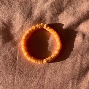 This bracelet is called sun kiss and the colors are orange and it was homemade!